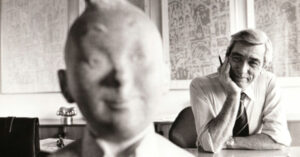Herge with a sculpture of Tintin